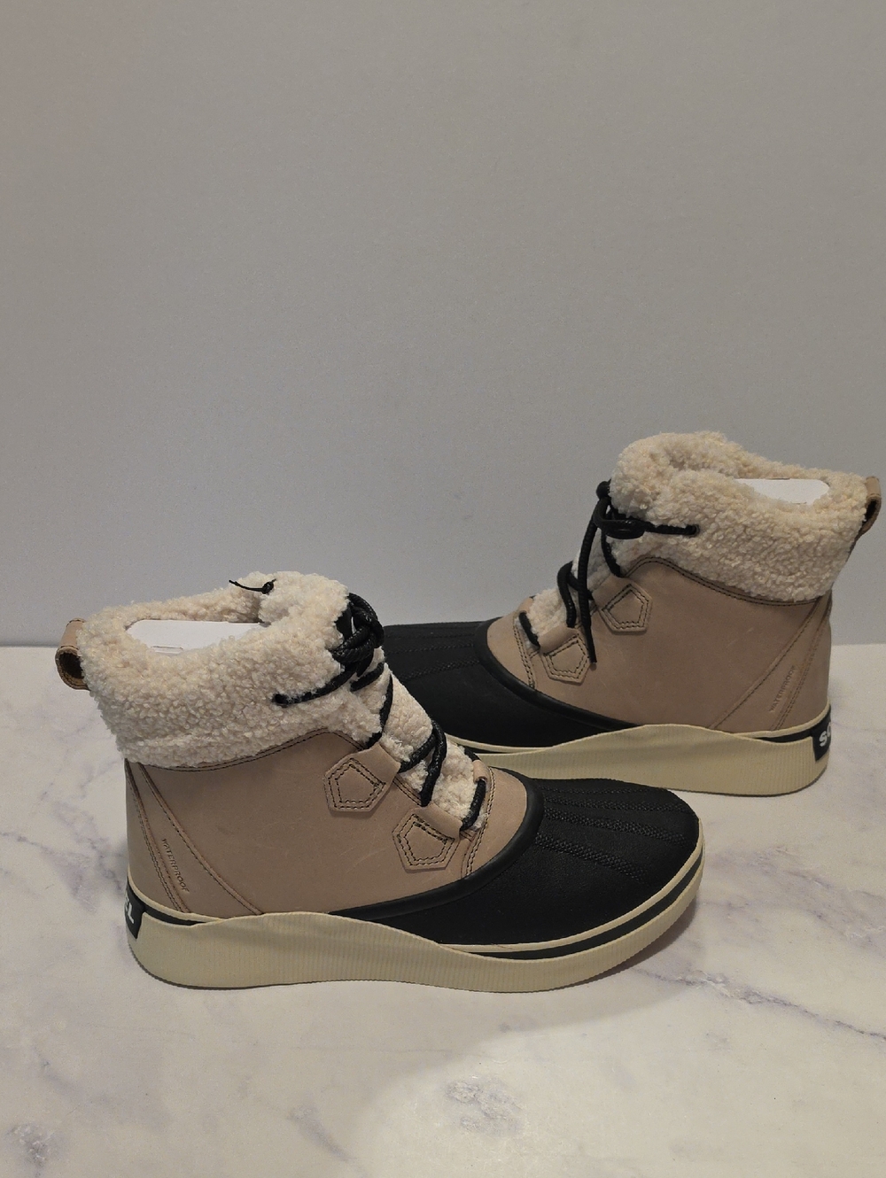 Sorel Out N About IV Cozy Winter Ankle Boots in Beige and Black